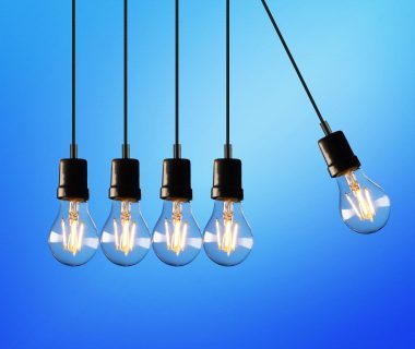 Illuminated light bulbs symbolize innovation amidst laws on artificial intelligence debate.