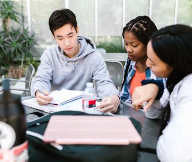 Students collaborating to develop digital literacy skills amidst challenges of AI laws.