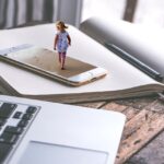 Smartphone displaying a digital scene, illustrating how consumers encounter AI-created ads on mobile devices