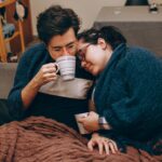 Couple sharing hot drinks, illustrating customer comfort and trust after an AI-generated ad purchase.